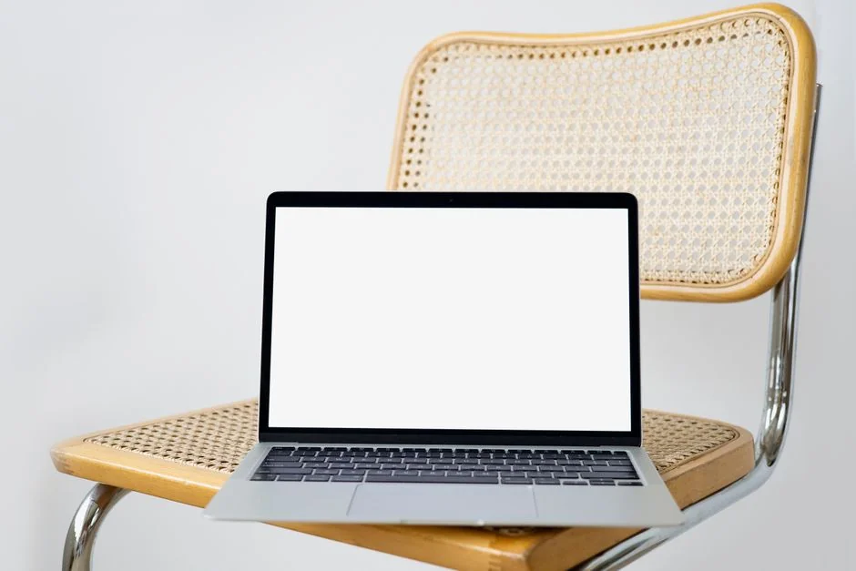 Outside, a woman relaxes with a magazine, coffee, and a laptop close at hand.